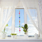 Multicolor Muschelkette am Fenster, 100cm lang, ideal als Fensterdeko.