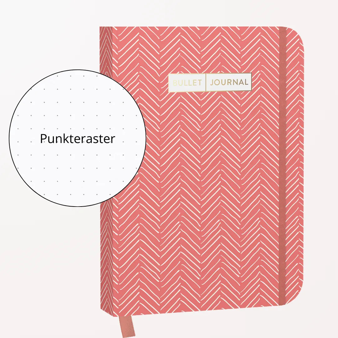 Korallfarbenes A5 Bullet Journal mit Chevron-Muster und Goldprägung, zeigt Detail des Punktrasters.