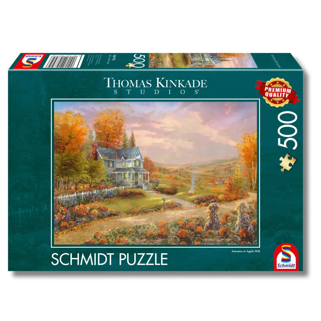 Karton des 500-Teile Schmidt Puzzles 'Autumn at Apple Hill' aus den Thomas Kinkade Studios mit einem idyllischen Herbstmotiv.