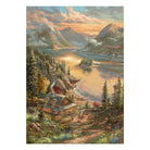 Detailliertes Motiv des Schmidt Puzzles 500 Teile "Pracht am Seeufer" von Thomas Kinkade. Eine friedliche Landschaft am See mit einer beleuchteten Hütte, hohen Bergen, dichten Nadelbäumen und warmem Abendlicht.